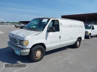 1999 Ford Econoline Cargo with VIN 1FTRE1428XHA20390, listed as a IAAI auction lot 41806875 with 207,954 mi miles. Bid and sale history available at carsss.com. Image 2.
