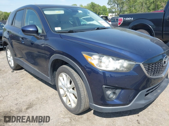 2014 Mazda CX-5 Grand Touring with VIN JM3KE4DYXE0342720, listed as a IAAI auction lot 42026388 with 114,072 mi miles and . Bid and sale history available at carsss.com. Image 1.