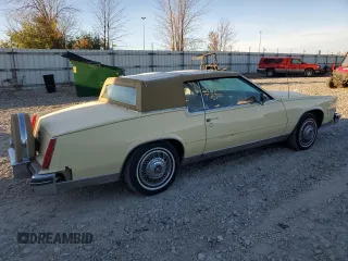 1985 Cadillac Eldorado z VIN 1G6EL5781FE647818, wystawiony jako Copart lot #77608224 z przebiegiem 7192 mil mil oraz Tytuł czysty. Historia ofert i sprzedaży dostępna na DreamBid. Obrazek 3.