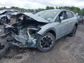 2021 Subaru Crosstrek Premium z VIN JF2GTAPC5M8331242, wystawiony jako IAAI lot #42306131 z przebiegiem 26 786 mil mil oraz . Historia ofert i sprzedaży dostępna na DreamBid. Obrazek 2.