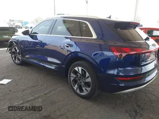 2021 Audi e-tron Premium Plus with VIN WA1LAAGE4MB038563, listed as a IAAI auction lot 42422063 with 31,645 mi miles and . Bid and sale history available at DreamBid. Image 3.