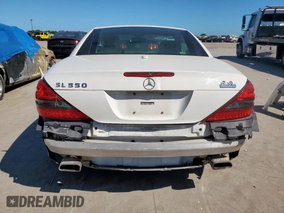 2009 Mercedes-Benz SL 550 with VIN WDBSK71F69F147589, listed as a Copart auction lot 65976995 with 77,387 mi miles and Salvage title. Bid and sale history available at DreamBid. Image 6.