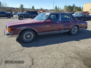 1986 Chevrolet Caprice z VIN 1G1BN69H0GX204734, wystawiony jako Copart lot #47292705 z przebiegiem 24 345 mil mil oraz Szkoda całkowita • Salvage title. Historia ofert i sprzedaży dostępna na DreamBid. Obrazek 1.