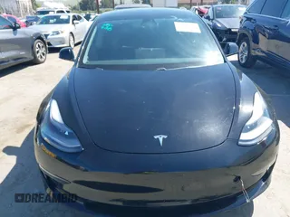 2021 Tesla Model 3 Long Range with VIN 5YJ3E1EB2MF065583, listed as a IAAI auction lot 42067399 with 52,333 mi miles. Bid and sale history available at carsss.com. Image 6.
