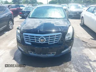 2013 Cadillac XTS Luxury z VIN 2G61P5S37D9101989, wystawiony jako IAAI lot #42242641 z przebiegiem 243 006 mil mil oraz . Historia ofert i sprzedaży dostępna na DreamBid. Obrazek 12.