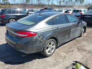 2018 Ford Fusion SE z VIN 3FA6P0H74JR233829, wystawiony jako IAAI lot #42049766 z przebiegiem 120 370 mil mil oraz . Historia ofert i sprzedaży dostępna na DreamBid. Obrazek 4.
