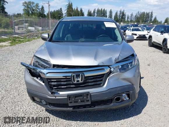2019 Honda Ridgeline RTL with VIN 5FPYK3F54KB018272, listed as a IAAI auction lot 42184895 with 75,362 mi miles and . Bid and sale history available at DreamBid. Image 12.