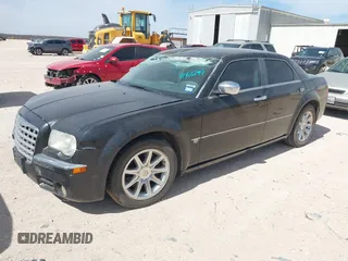 2006 Chrysler 300 C with VIN 2C3KA63H56H316500, listed as a IAAI auction lot 41811247 with 135,100 mi miles. Bid and sale history available at carsss.com. Image 2.