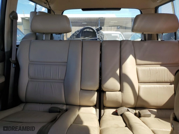 1997 Toyota Land Cruiser with VIN JT3HJ85J2V0180979, listed as a Copart auction lot 73216714 with 239,444 mi miles and Salvage Title. Bid and sale history available at carsss.com. Image 10.