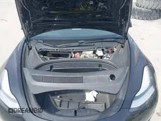 2020 Tesla Model 3 Standard Range Plus with VIN 5YJ3E1EAXLF643807, listed as a IAAI auction lot 41789406 with 49,256 mi miles. Bid and sale history available at carsss.com. Image 10.