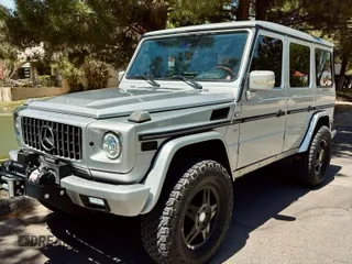 2002 Mercedes-Benz G 500 with VIN WDCYR49EX2X128555, listed as a Copart auction lot 55605995 with 225,042 mi miles and Salvage Title. Bid and sale history available at DreamBid. Image 2.