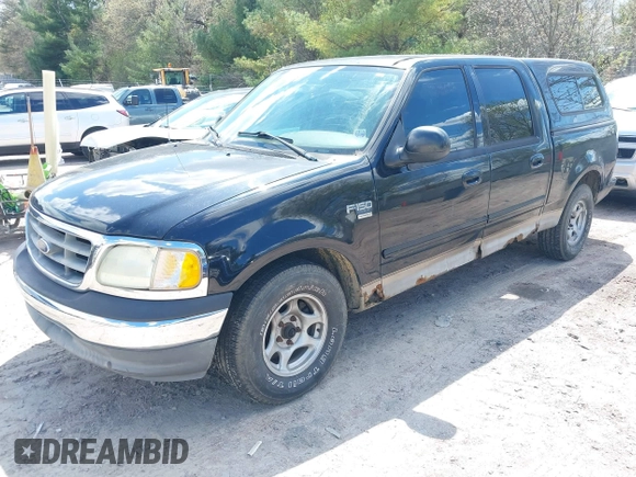 2003 Ford F-150 XLT with VIN 1FTRW07613KC71609, listed as a IAAI auction lot 42186741 with 190,591 mi miles. Bid and sale history available at carsss.com. Image 2.