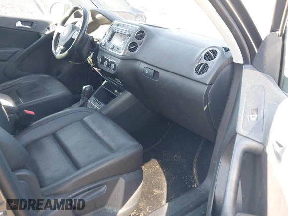 2012 Volkswagen Tiguan SE with VIN WVGAV7AX5CW000275, listed as a IAAI auction lot 41789246 with 123,618 mi miles and . Bid and sale history available at DreamBid. Image 5.