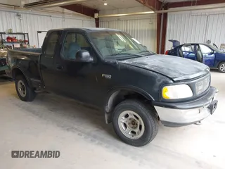 1997 Ford F-150 z VIN 1FTEX08L6VKC11215, wystawiony jako IAAI lot #42255036 z przebiegiem 235 979 mil mil oraz . Historia ofert i sprzedaży dostępna na DreamBid. Obrazek 1.