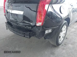 2011 Cadillac SRX Luxury Collection z VIN 3GYFNAEY9BS653352, wystawiony jako IAAI lot #42345078 z przebiegiem 118 030 mil mil oraz . Historia ofert i sprzedaży dostępna na DreamBid. Obrazek 12.