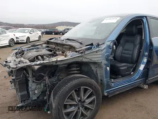 2017 Mazda CX-5 Grand Touring with VIN JM3KFADL9H0187338, listed as a IAAI auction lot 41382034 with 141,972 mi miles and . Bid and sale history available at carsss.com. Image 6.