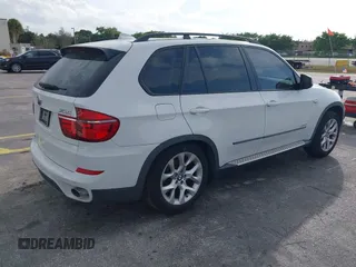 2011 BMW X5 35i with VIN 5UXZV4C54BL412770, listed as a IAAI auction lot 41618946 with 148,612 mi miles. Bid and sale history available at carsss.com. Image 4.