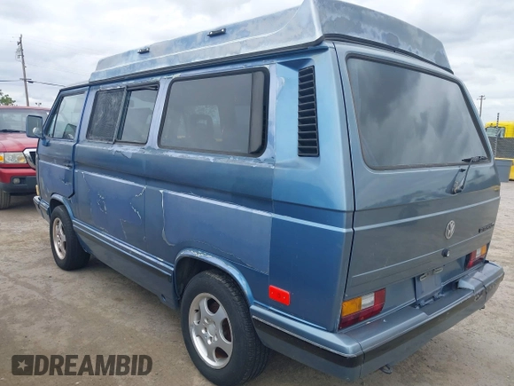 1989 Volkswagen Vanagon with VIN WV2YB0252KH059286, listed as a IAAI auction lot 42137080 with 130,604 mi miles and . Bid and sale history available at DreamBid. Image 3.