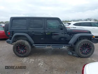 2022 Jeep Wrangler Unlimited Sport S z VIN 1C4HJXDG0NW133801, wystawiony jako IAAI lot #41908846 z przebiegiem 44 743 mil mil oraz . Historia ofert i sprzedaży dostępna na DreamBid. Obrazek 13.