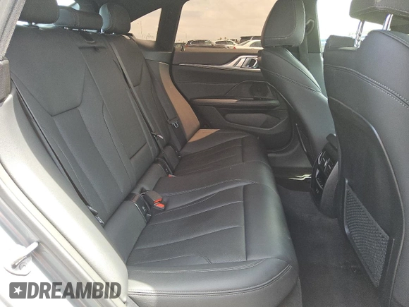 2024 BMW i4 eDrive40 z VIN WBY73AW0XRFS98892, wystawiony jako Copart lot #56057495 z przebiegiem 24 943 mil mil oraz Tytuł czysty. Historia ofert i sprzedaży dostępna na DreamBid. Obrazek 10.