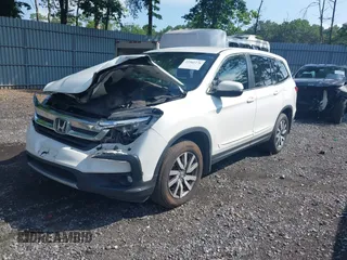 2021 Honda Pilot EX with VIN 5FNYF6H38MB072297, listed as a IAAI auction lot 42561276 with 119,172 mi miles and . Bid and sale history available at DreamBid. Image 2.
