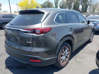 2017 Mazda CX-9 Touring with VIN JM3TCBCY1H0131233, listed as a IAAI auction lot 42490137 with 84,216 mi miles and . Bid and sale history available at DreamBid. Image 4.