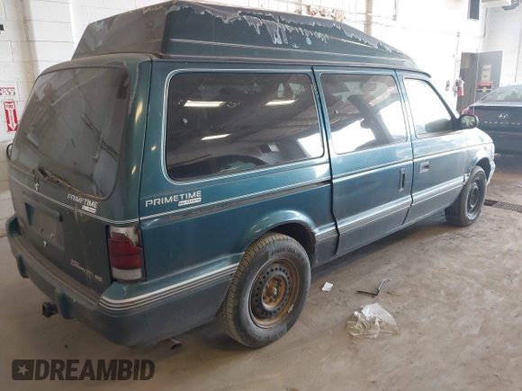 1995 Dodge Caravan Grand SE with VIN 1B4GH44R3SX566801, listed as a IAAI auction lot 42699597 with 103,069 mi miles and . Bid and sale history available at DreamBid. Image 4.