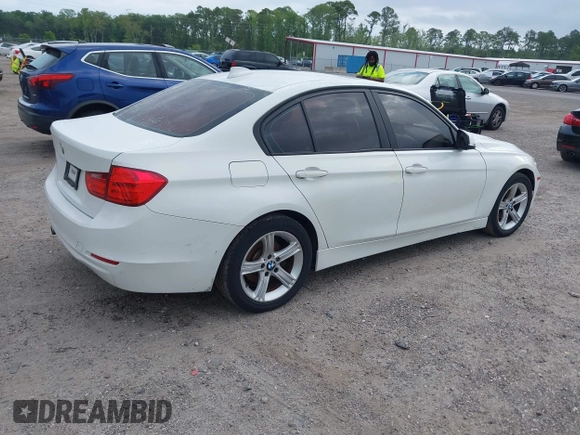 2015 BMW 3 Series 328i with VIN WBA3A5C50FF608327, listed as a IAAI auction lot 42136156 with 213,945 mi miles. Bid and sale history available at carsss.com. Image 4.