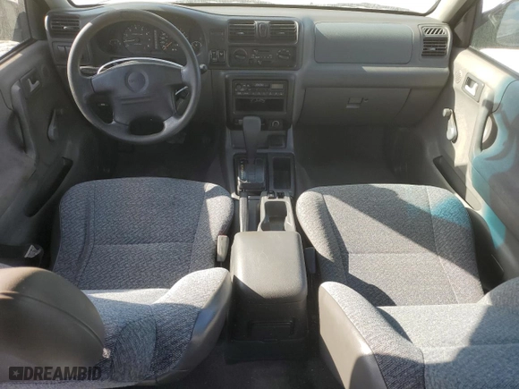 1999 Isuzu Rodeo S with VIN 4S2CK58W7X4357230, listed as a Copart auction lot 85214894 with 130,370 mi miles and Salvage Title. Bid and sale history available at carsss.com. Image 8.