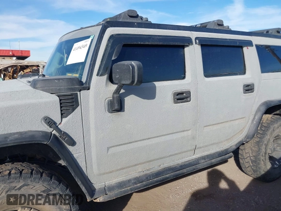2003 Hummer H2 with VIN 5GRGN23U13H128617, listed as a IAAI auction lot 41494349 with 135,295 mi miles. Bid and sale history available at carsss.com. Image 14.