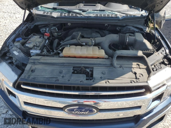 2018 Ford F-150 XL с VIN 1FTEX1EP3JFA77523, выставлен на аукционе Copart как лот 60568175 с пробегом 116 752 миль миль и Списание • Salvage title. История ставок и продаж доступна на DreamBid. Изображение 11.