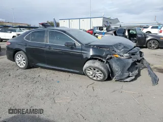 2019 Toyota Camry LE with VIN 4T1B11HK3KU774056, listed as a Copart auction lot 51497175 with 129,690 mi miles and Salvage Title. Bid and sale history available at carsss.com. Image 4.