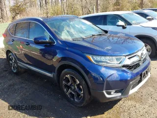 2018 Honda CR-V Touring with VIN 7FARW2H90JE078564, listed as a IAAI auction lot 41477203 with 61,424 mi miles. Bid and sale history available at carsss.com. Image 1.