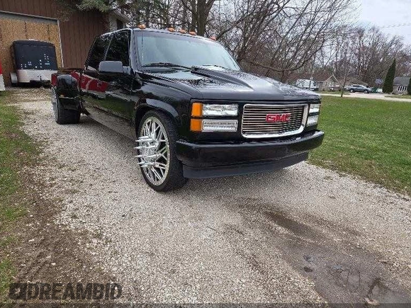 1997 GMC Sierra 3500 z VIN 1GTHC33J5VF005375, wystawiony jako IAAI lot #42298688 z przebiegiem 188 825 mil mil oraz . Historia ofert i sprzedaży dostępna na DreamBid. Obrazek 1.
