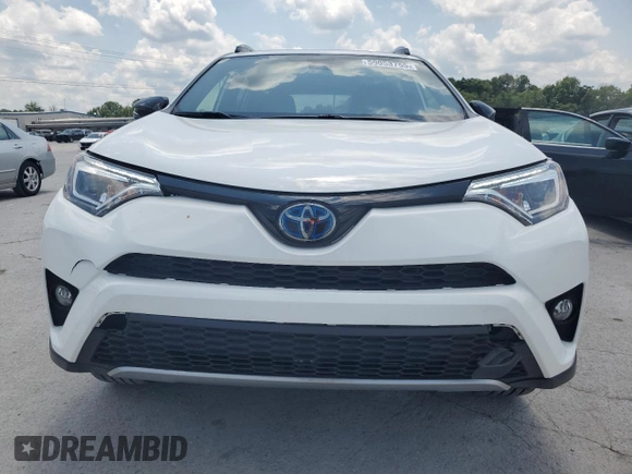 2018 Toyota RAV4 Hybrid SE with VIN JTMJJREVXJD212926, listed as a Copart auction lot 60215465 with 71,876 mi miles and Salvage title. Bid and sale history available at DreamBid. Image 5.