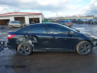 2013 Ford Focus SE z VIN 1FADP3F27DL342384, wystawiony jako IAAI lot #41474290 z przebiegiem 125 664 mil mil oraz . Historia ofert i sprzedaży dostępna na DreamBid. Obrazek 14.
