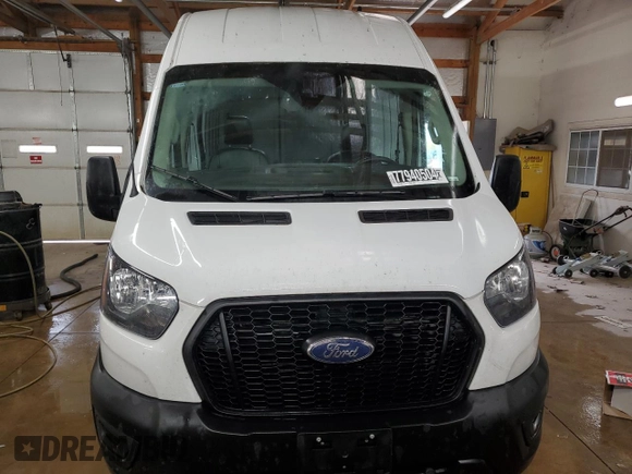 2023 Ford Transit Cargo with VIN 1FTBR3U89PKA70899, listed as a Copart auction lot 77940504 with 62,196 mi miles and Clean Title. Bid and sale history available at DreamBid. Image 5.