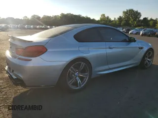2013 BMW M6 z VIN WBSLX9C58DD159800, wystawiony jako Copart lot #68904984 z przebiegiem 107 426 mil mil oraz Szkoda całkowita • Salvage title. Historia ofert i sprzedaży dostępna na DreamBid. Obrazek 3.