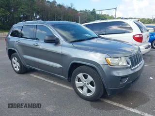 2011 Jeep Grand Cherokee Laredo z VIN 1J4RR4GG7BC736694, wystawiony jako IAAI lot #42758461 z przebiegiem 159 875 mil mil oraz . Historia ofert i sprzedaży dostępna na DreamBid. Obrazek 1.