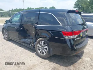2015 Honda Odyssey Touring Elite with VIN 5FNRL5H90FB003506, listed as a IAAI auction lot 42585049 with 120,543 mi miles and . Bid and sale history available at DreamBid. Image 3.
