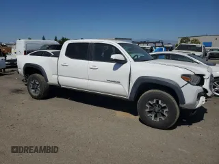2017 Toyota Tacoma SR5 with VIN 3TMDZ5BN2HM027836, listed as a Copart auction lot 57299415 with 124,255 mi miles and Salvage title. Bid and sale history available at DreamBid. Image 4.