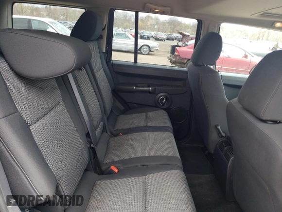 2009 Jeep Commander Sport z VIN 1J8HG48K39C554570, wystawiony jako Copart lot #52667825 z przebiegiem 194 886 mil mil oraz Szkoda całkowita • Salvage title. Historia ofert i sprzedaży dostępna na DreamBid. Obrazek 11.