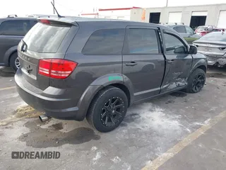 2014 Dodge Journey American Value Pkg with VIN 3C4PDCAB5ET235427, listed as a IAAI auction lot 41056216 with 164,740 mi miles. Bid and sale history available at carsss.com. Image 4.