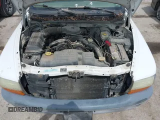 2001 Dodge Dakota with VIN 1B7FL26XX1S249462, listed as a IAAI auction lot 42003993 with 228,398 mi miles. Bid and sale history available at carsss.com. Image 10.