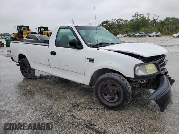2002 Ford F-150 XL with VIN 1FTRF17W32NB86385, listed as a Copart auction lot 73276754 with 100,817 mi miles and Salvage Title. Bid and sale history available at carsss.com. Image 4.
