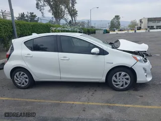 2015 Toyota Prius c One with VIN JTDKDTB3XF1097538, listed as a IAAI auction lot 42031057 with 100,847 mi miles. Bid and sale history available at carsss.com. Image 13.
