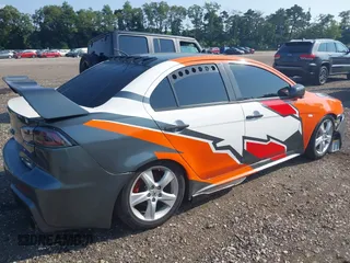 2014 Mitsubishi Lancer GT with VIN JA32U8FW6EU015415, listed as a IAAI auction lot 40171318 with 40,000 mi miles. Bid and sale history available at carsss.com. Image 4.