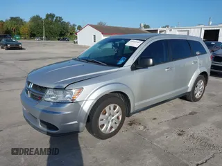 2014 Dodge Journey SE with VIN 3C4PDCAB0ET221998, listed as a IAAI auction lot 40609907 with 203,241 mi miles and . Bid and sale history available at carsss.com. Image 2.