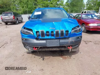 2020 Jeep Cherokee Trailhawk with VIN 1C4PJMBXXLD636547, listed as a IAAI auction lot 42314654 with 59,061 mi miles and . Bid and sale history available at DreamBid. Image 6.