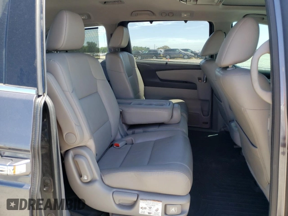2014 Honda Odyssey Touring с VIN 5FNRL5H92EB116923, выставлен на аукционе Copart как лот 58060645 с пробегом 106 285 миль миль и Списание • Salvage title. История ставок и продаж доступна на DreamBid. Изображение 11.